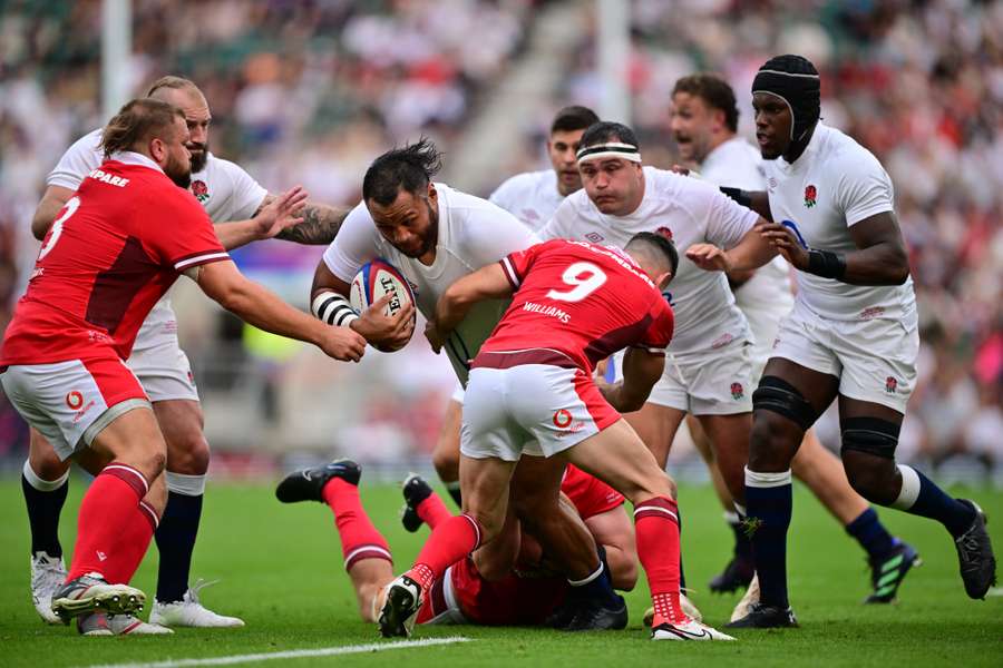 England's number eight Billy Vunipola (C) is tackled during the Summer Series international rugby union match between England and Wales 