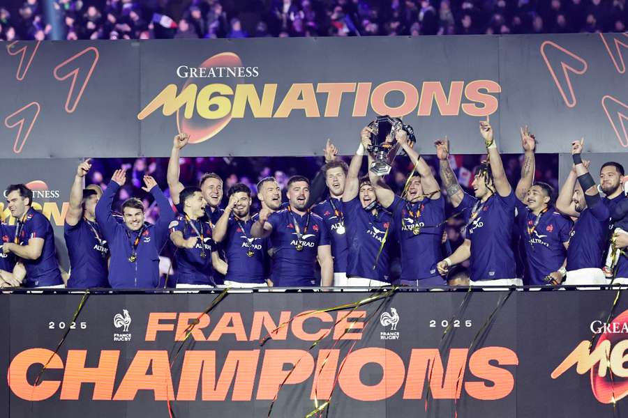 France's players celebrate with the trophy after winning the Six Nations international rugby union tournament