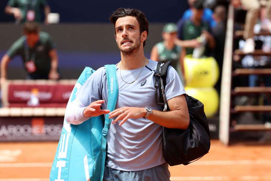 Lorenzo Musetti reacts after retiring at the Italian Open Lorenzo Musetti reacts after retiring at the Italian Open
