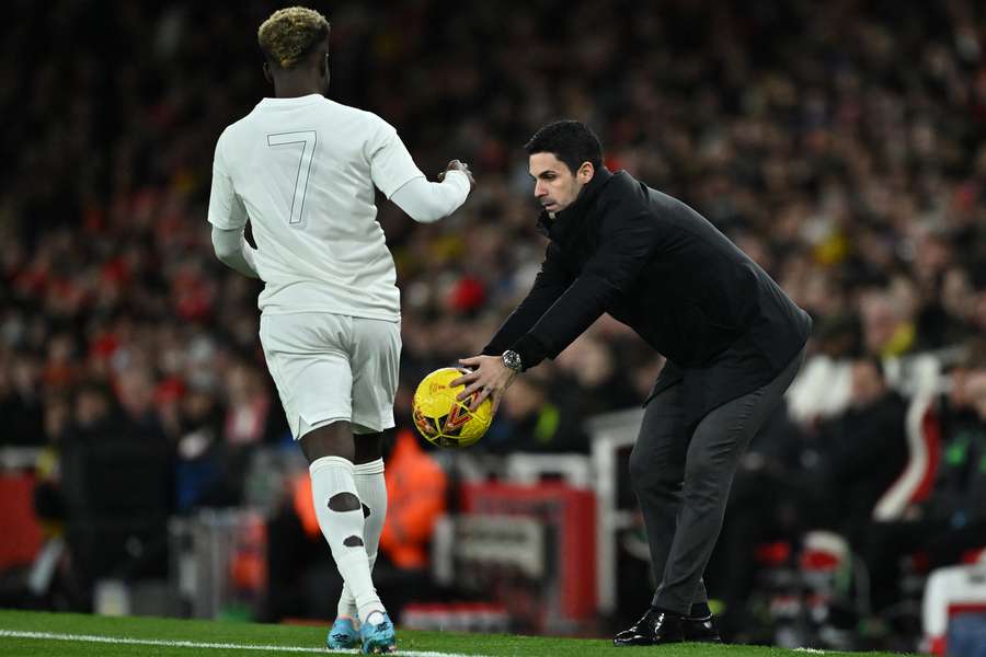 Arsenal's Spanish manager Mikel Arteta returns the ball during the English FA Cup third round football match between Arsenal and Liverpool 