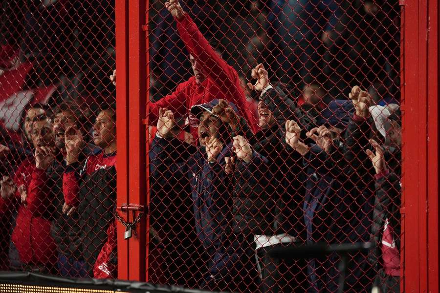 Fans of Argentina's Independiente try to open a door during the Copa Sudamericana match against Universidad de Chile