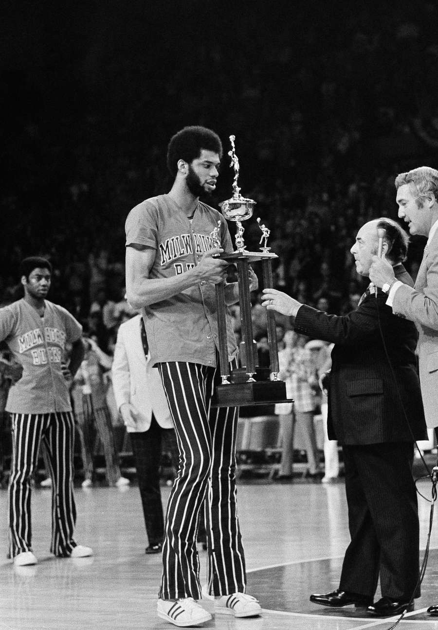 Kareem Abdul-Jabbar is awarded his third NBA MVP award by NBA Commissioner J. Walter Kennedy