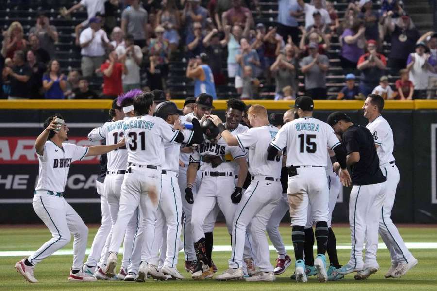 Corbin Carroll celebrates his walk off two RBI single against the Colorado Rockies