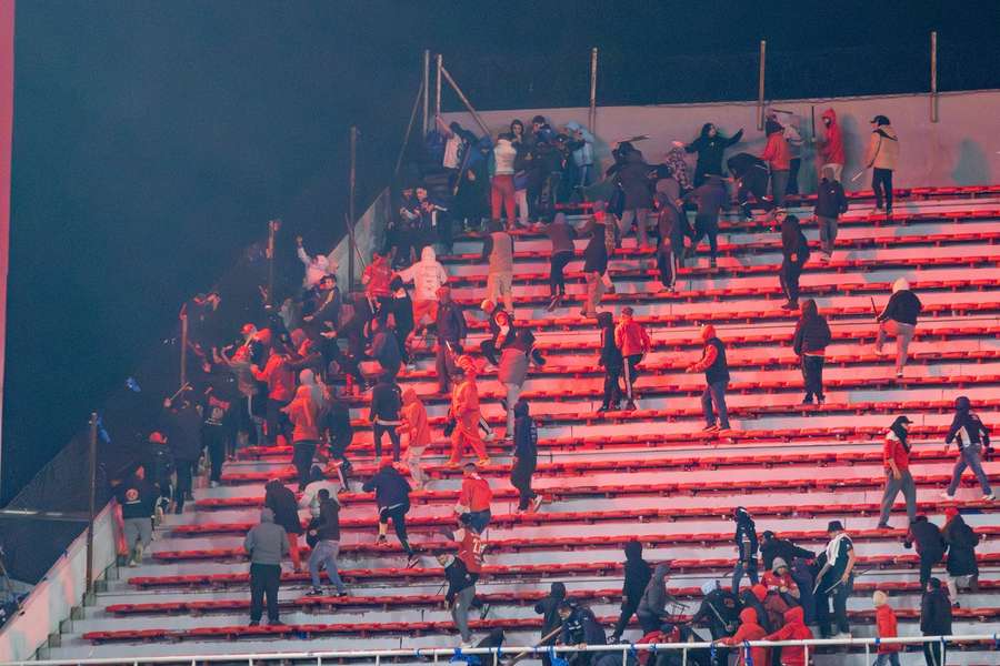 Fans clash in the match between Independiente and Universidad de Chile
