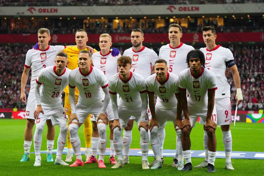 Poland players pose for a team group photo before the match with Portugal