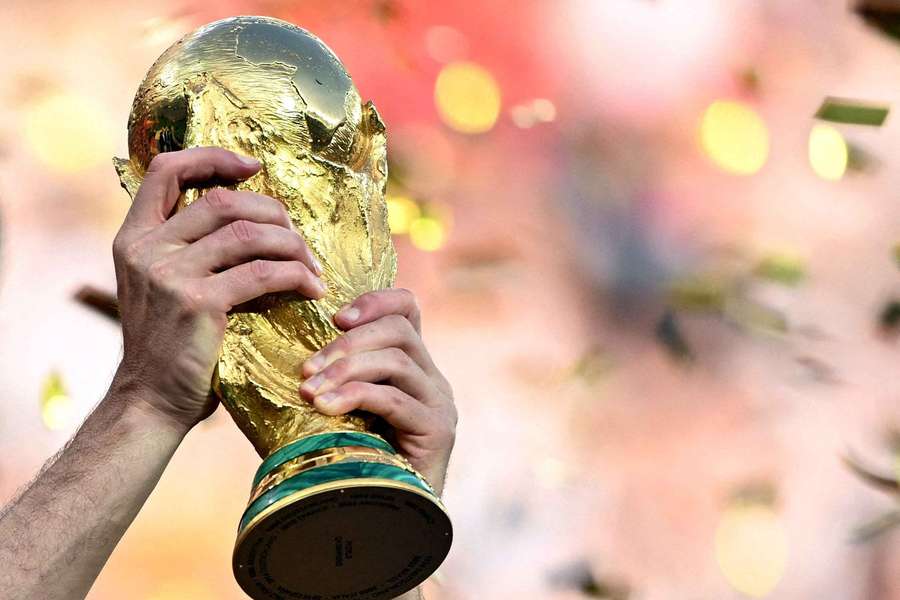Spain's Aymeric Laporte lifts the World Cup trophy as he celebrates winning the World Cup Spain's Aymeric Laporte lifts the World Cup trophy as he celebrates winning the World Cup