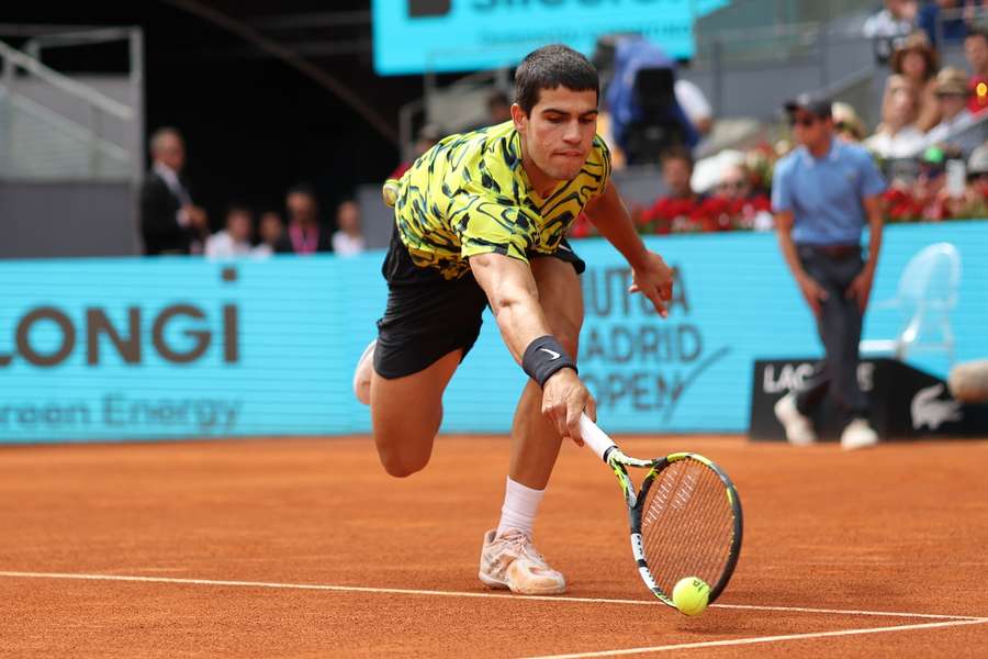 Spain's Carlos Alcaraz returns the ball to Germany's Alexander Zverev during his victory at the Madrid Open