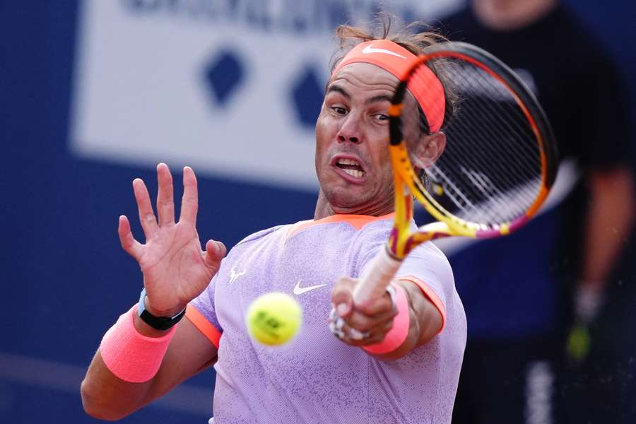 Spain's Rafael Nadal serves the ball to Italy's Flavio Cobolli
