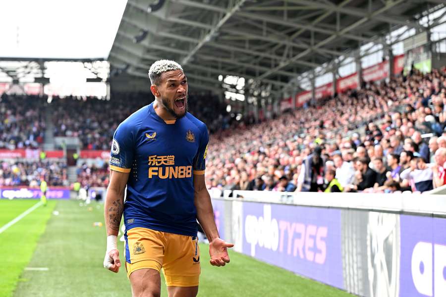 Brazilian midfielder Joelinton celebrates their equalising goal during the English Premier League football match between Brentford and Newcastle United