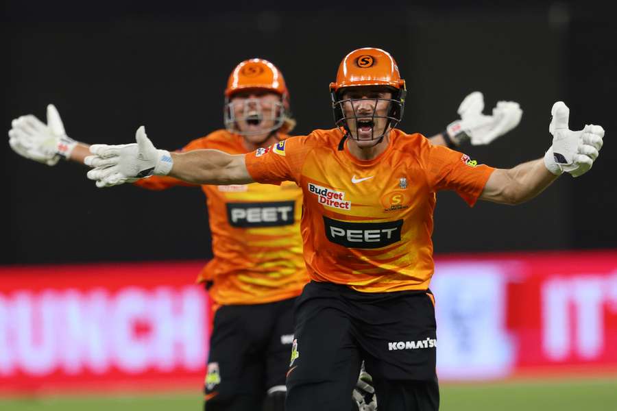 Perth Scorchers' Nick Hobson (R) and teammate Cooper Connolly celebrate after scoring the winning runs