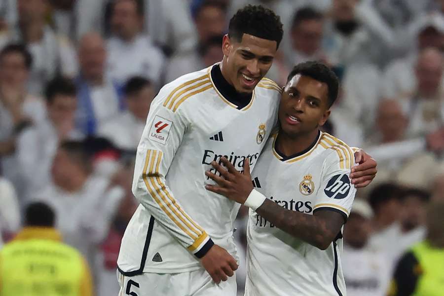 Real Madrid midfielder Jude Bellingham (L) celebrates scoring his team's third goal with Rodrygo