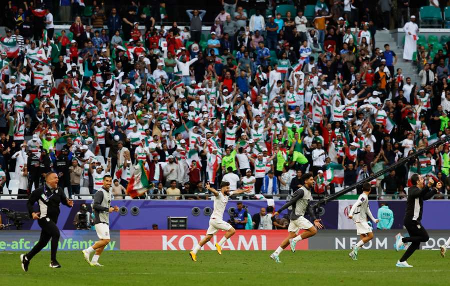 Iran's players celebrate after the match