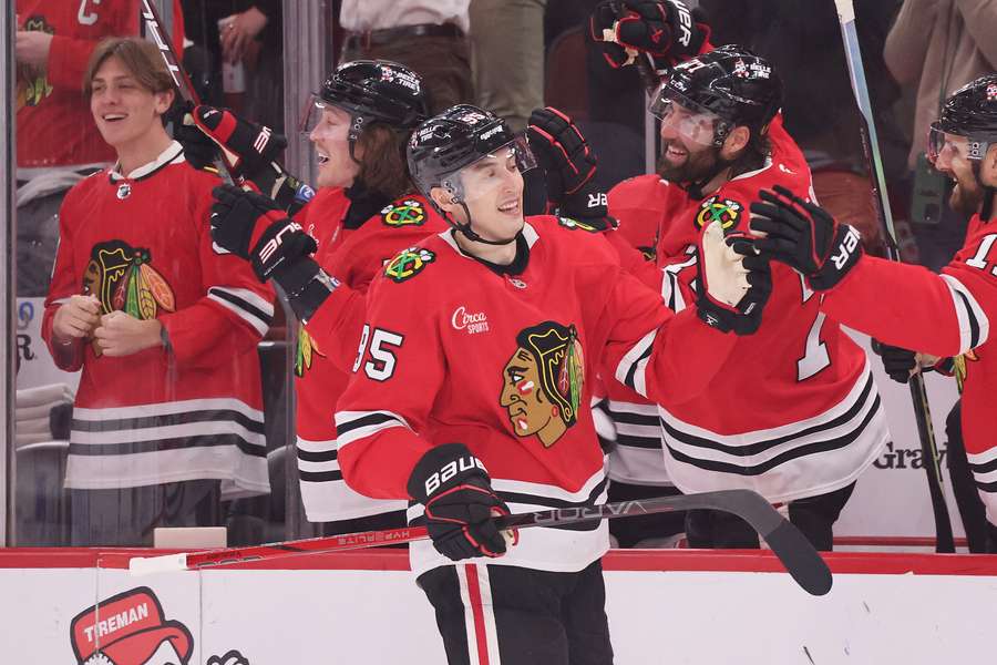 Blackhawks players celebrate after a win against the Washington Capitals