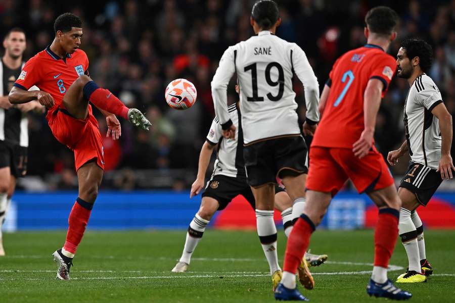 Jude Bellingham (L) controls the ball during the UEFA Nations League group match between England and Germany