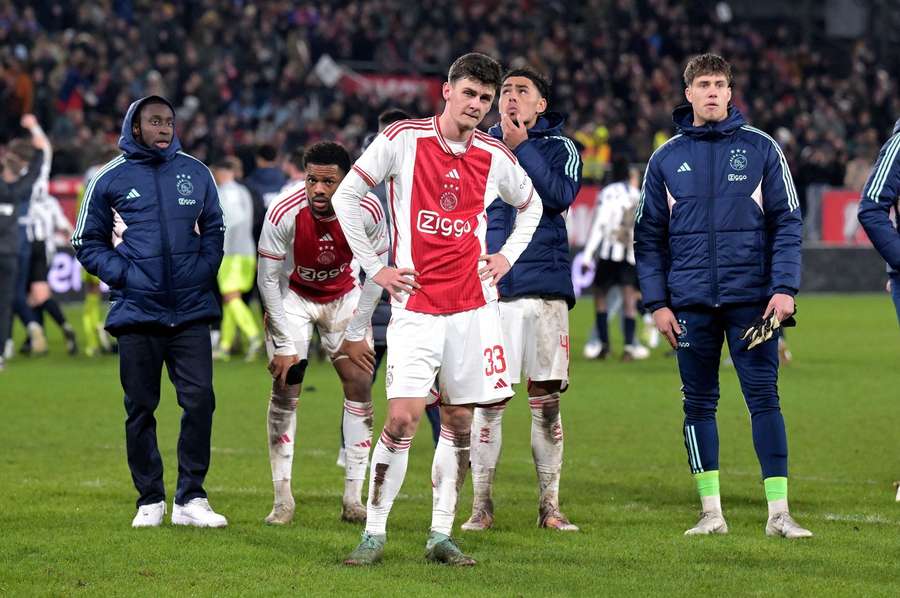 Benjamin Tahirovic and Ajax players look on dejected after losing to amateur side USV Hercules in the KNVB Cup