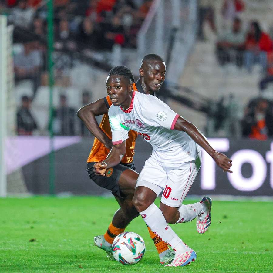 The two sides in action during the first leg in Morocco