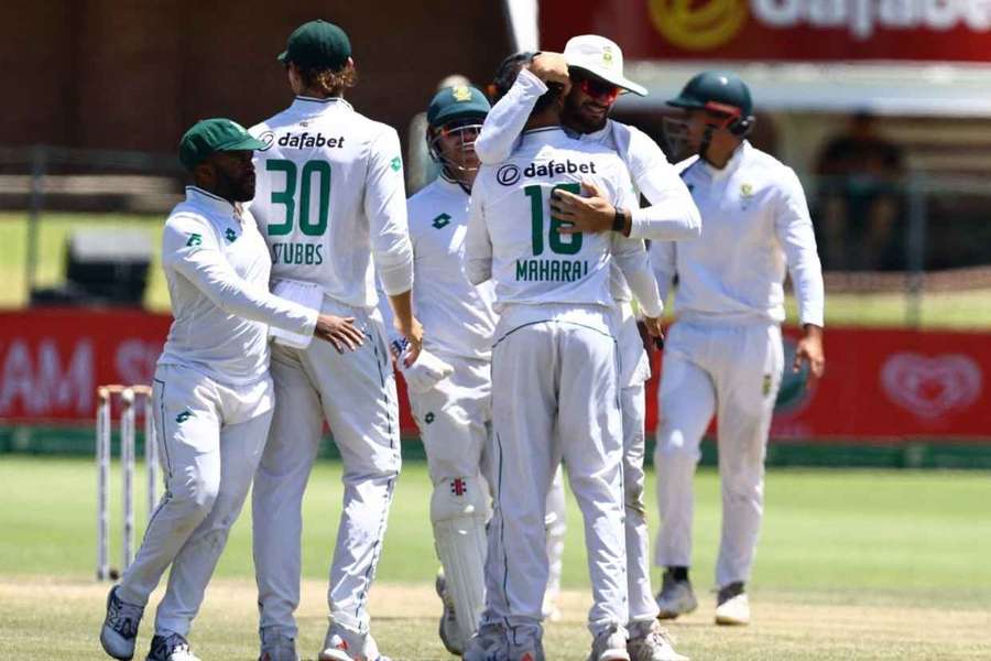 South Africa players congratulate Keshav Maharaj on his fiver after the dismissal of Vishwa Fernando