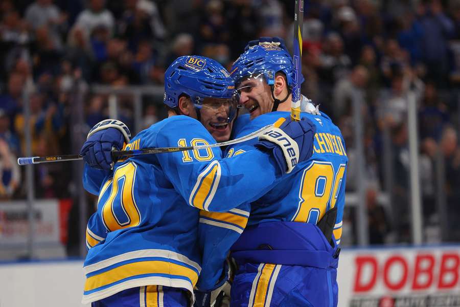 St. Louis Blues players celebrating after a goal St. Louis Blues players celebrating after a goal