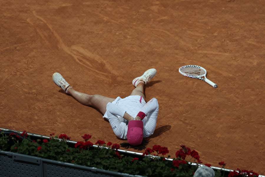 Poland's Iga Swiatek reacts to beating Belarus' Aryna Sabalenka during the 2024 WTA Tour Madrid Open tournament final