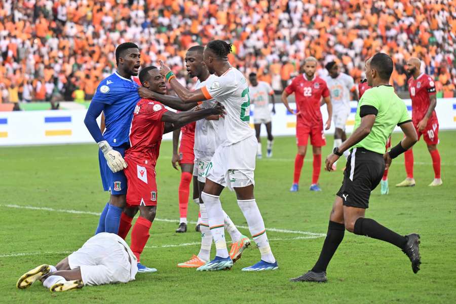 Ivory Coast forward Christian Kouame argues with Equatorial Guinea goalkeeper esus Owono