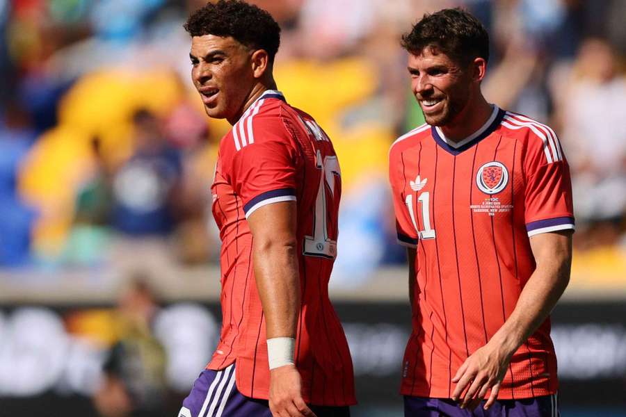 Scotland's Che Adams celebrates scoring their fourth goal with Ryan Christie