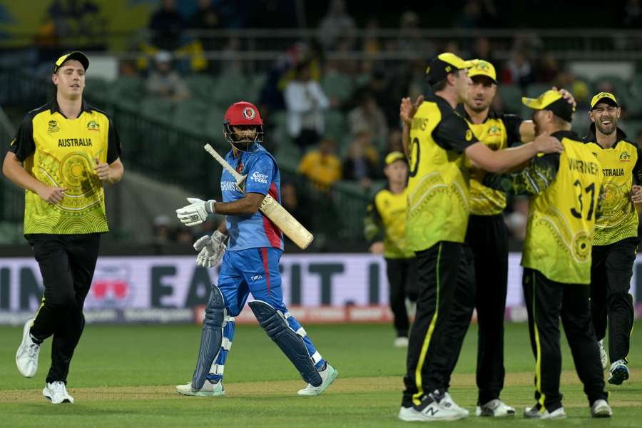 The Australia players celebrate their win against Afghanistan