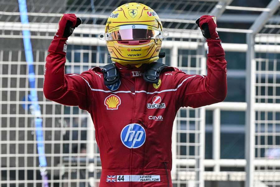 Lewis Hamilton celebrates winning his first race for Ferrari