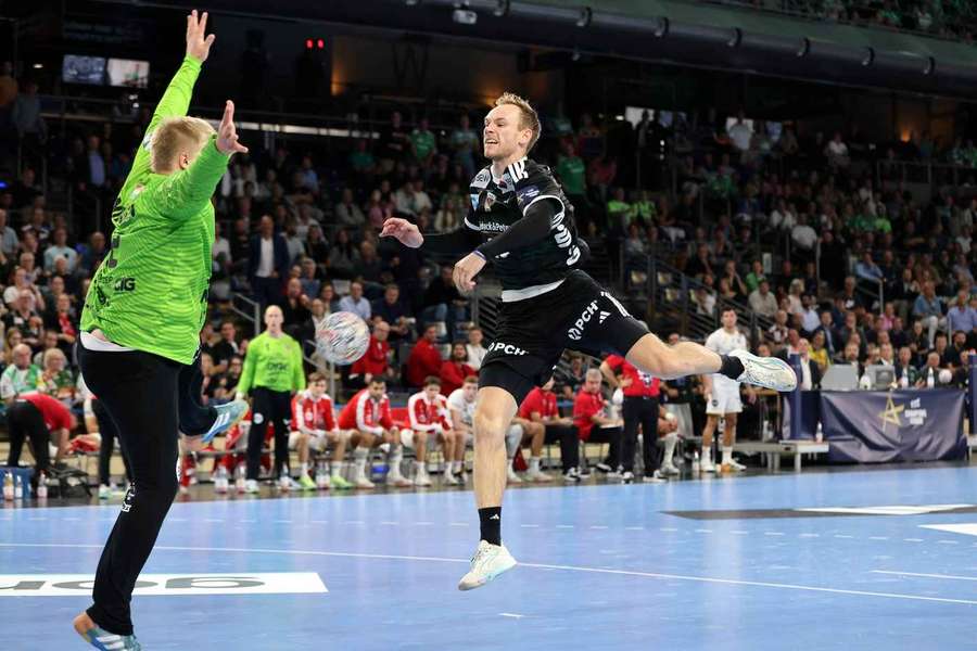 Emil Nielsen in a direct challenge with Fuchse Berlin's Mathias Gidsel Emil Nielsen in a direct challenge with Fuchse Berlin's Mathias Gidsel