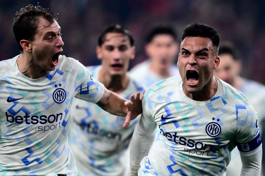 Inter's Argentine forward Lautaro Martinez (right) celebrates after scoring against Genoa with Nicolo Barella Inter's Argentine forward Lautaro Martinez (right) celebrates after scoring against Genoa with Nicolo Barella