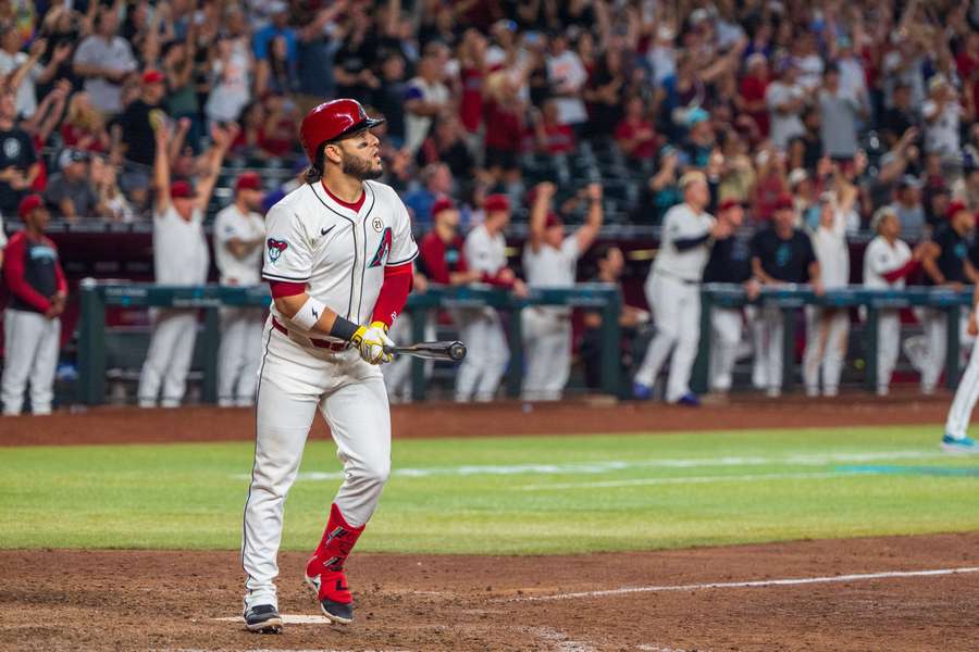 Suarez reacts after hitting a sharp fly ball to right field to score the winning runs