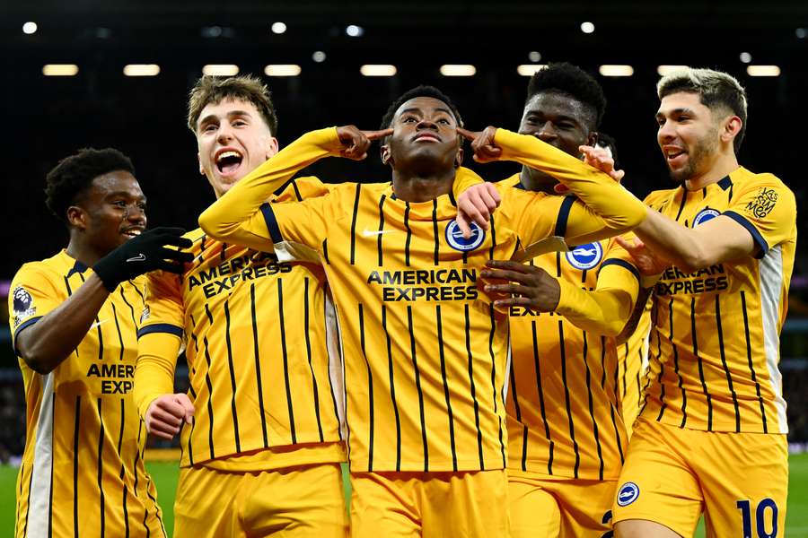 Simon Adingra celebrates scoring Brighton's opening goal at Villa Park