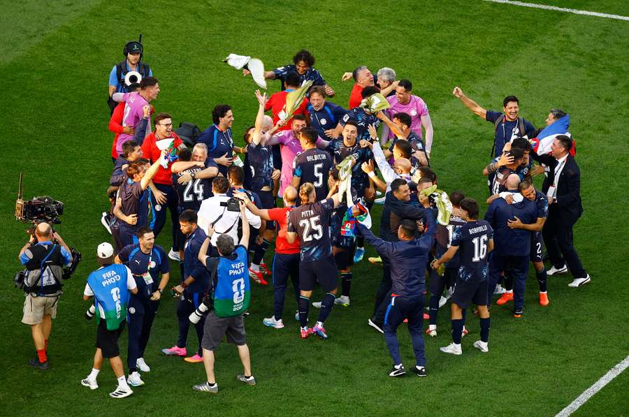 Paraguay celebrate advancing to the round of 16.