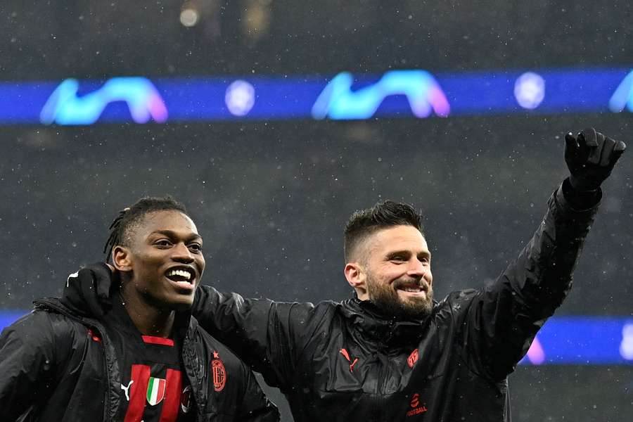 AC Milan's Portuguese forward Rafael Leao and French forward Olivier Giroud celebrate at the end of the UEFA Champions League win over Tottenham Hotspur AC Milan's Portuguese forward Rafael Leao and French forward Olivier Giroud celebrate at the end of the UEFA Champions League win over Tottenham Hotspur