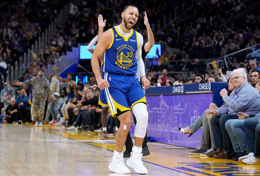 Stephen Curry #30 of the Golden State Warriors reacts towards the Toronto Raptors bench after he made a three-point shot during the third quarter 