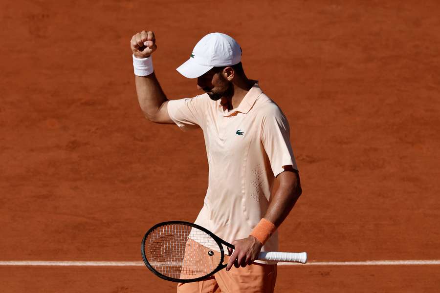 Djokovic reacts during his second-round match Djokovic reacts during his second-round match