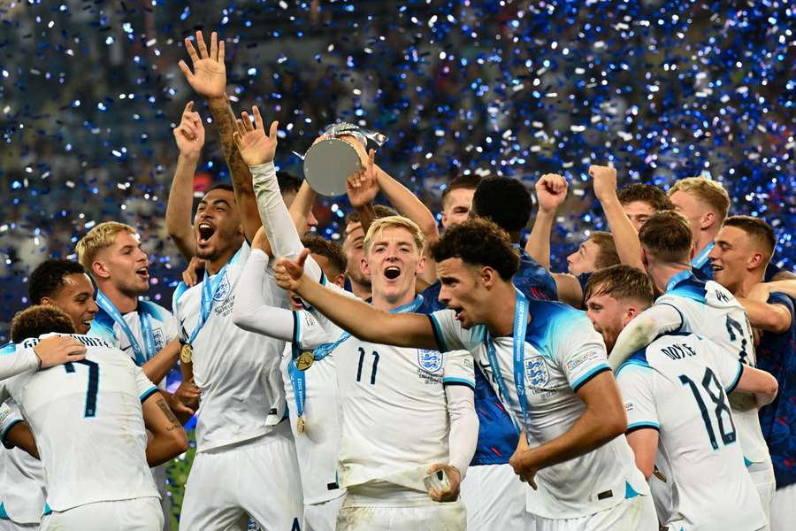 England's players celebrate with the trophy