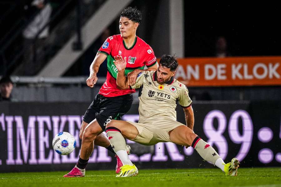 Excelsior's Alireza Jahanbakhsh battles with NEC's Adam Tahaui
