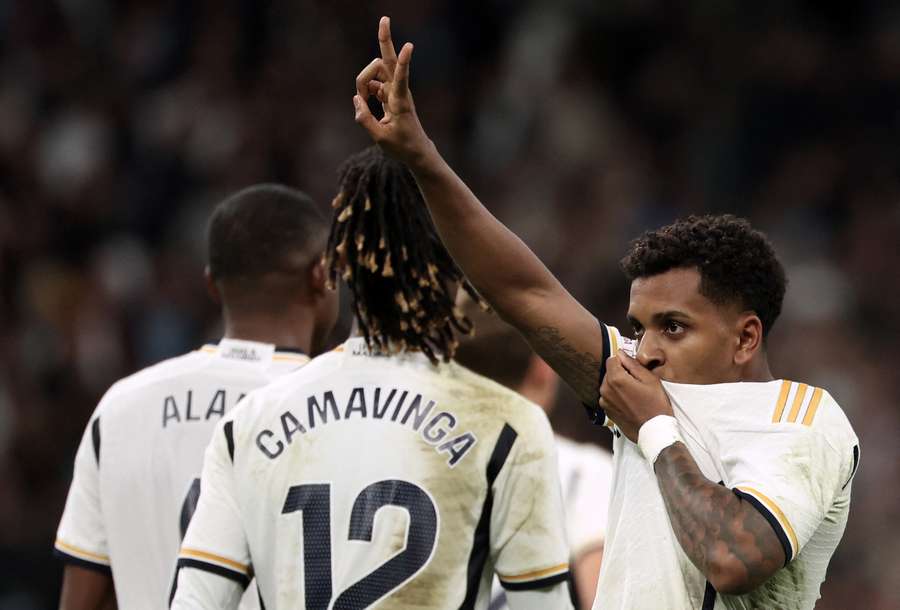 Rodrygo (R) celebrates scoring his team's fifth goal