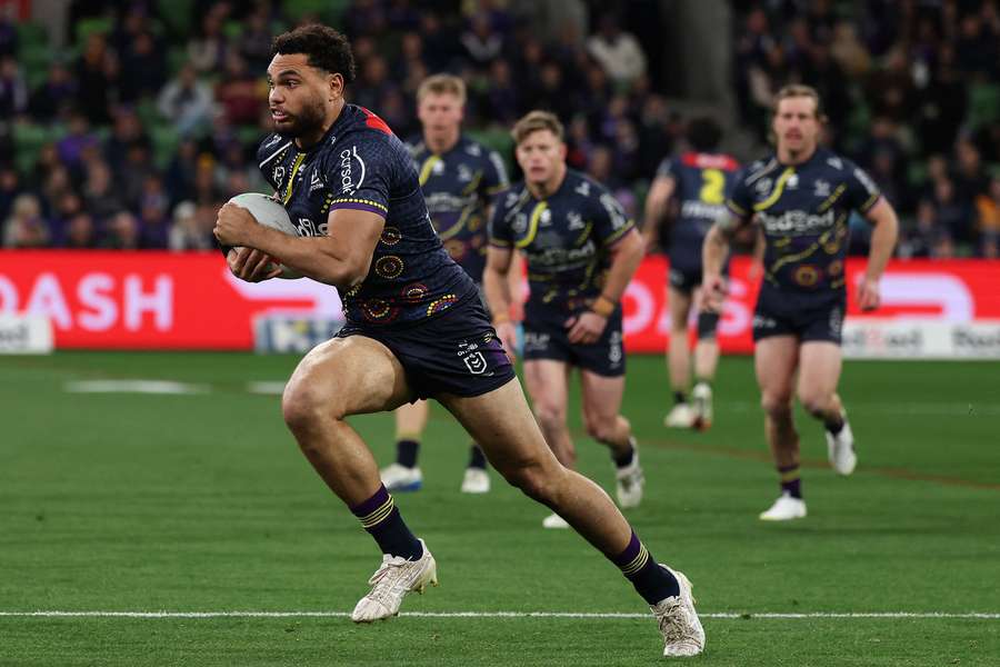 Melbourne Storm's Xavier Coates charges down the field during his eventually disallowed try. 