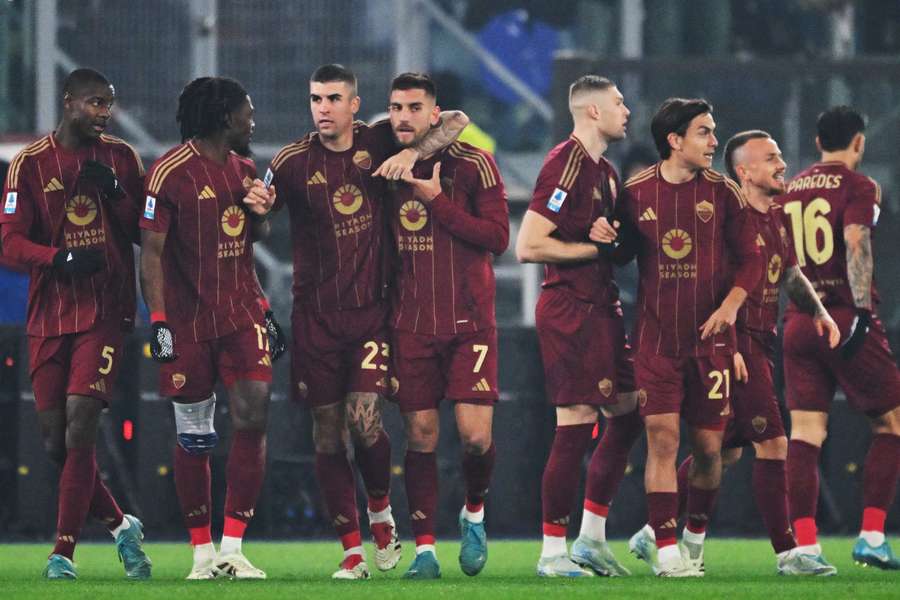 Roma celebrate a goal against Lazio