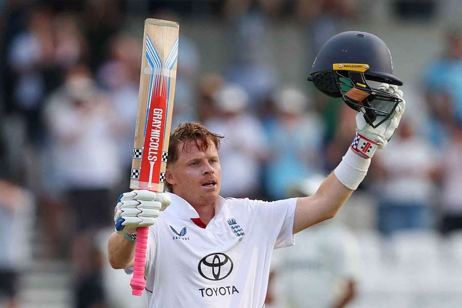 England's Ollie Pope celebrates after reaching his century