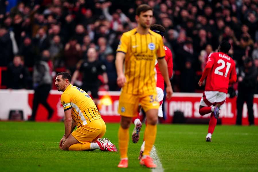 Brighton and Hove Albion's Lewis Dunk looks dejected after scoring an own goal