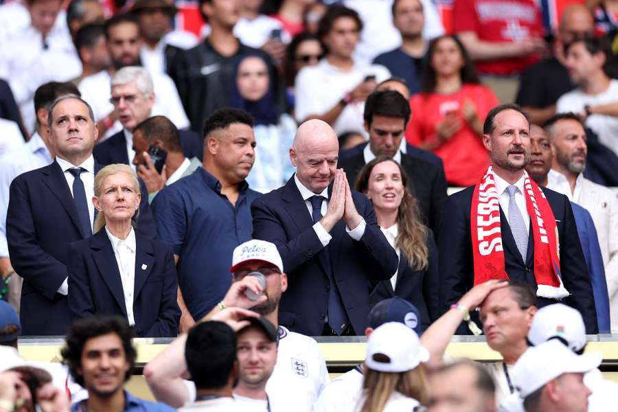 Debbie Hewitt (L) stands beside Gianni Infantino ahead of the quarterfinal of the 2026 FIFA World Cup between Norway and England