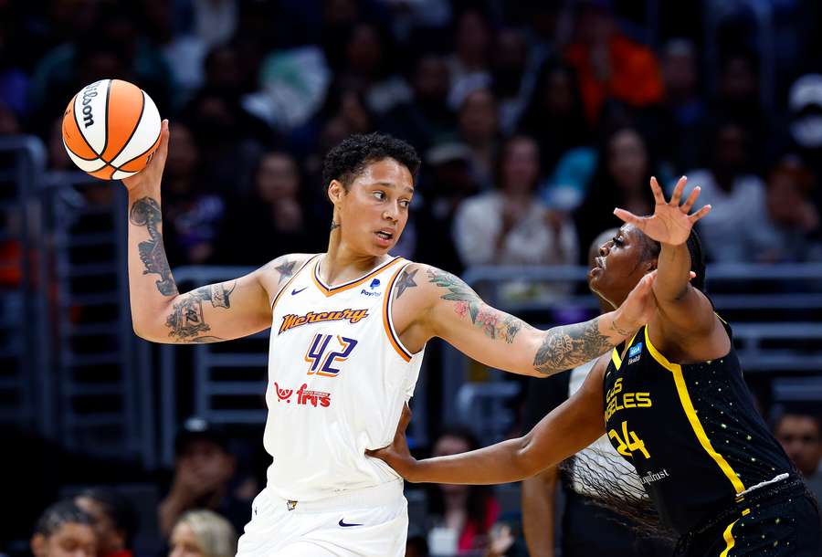 Brittney Griner of the Phoenix Mercury controls the ball against Joyner Holmes of the Los Angeles Sparks