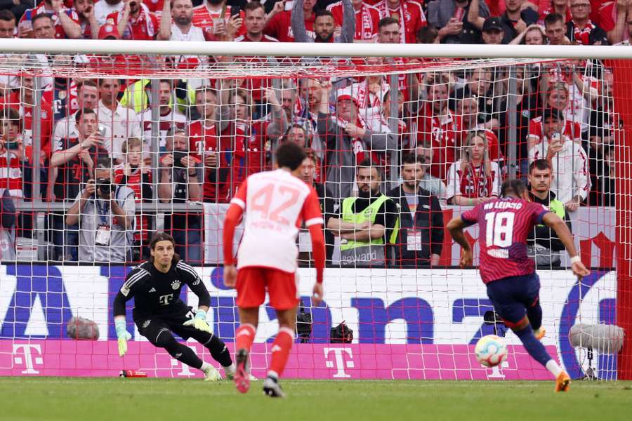 Christopher Nkunku slots home his penalty to stun the Allianz Arena