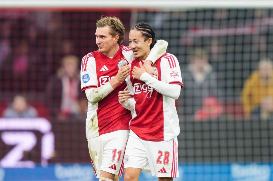 Ajax's Kian Fitz-Jim (R) is embraced by Mika Godts after the Eredivisie match against Feyenoord Ajax's Kian Fitz-Jim (R) is embraced by Mika Godts after the Eredivisie match against Feyenoord