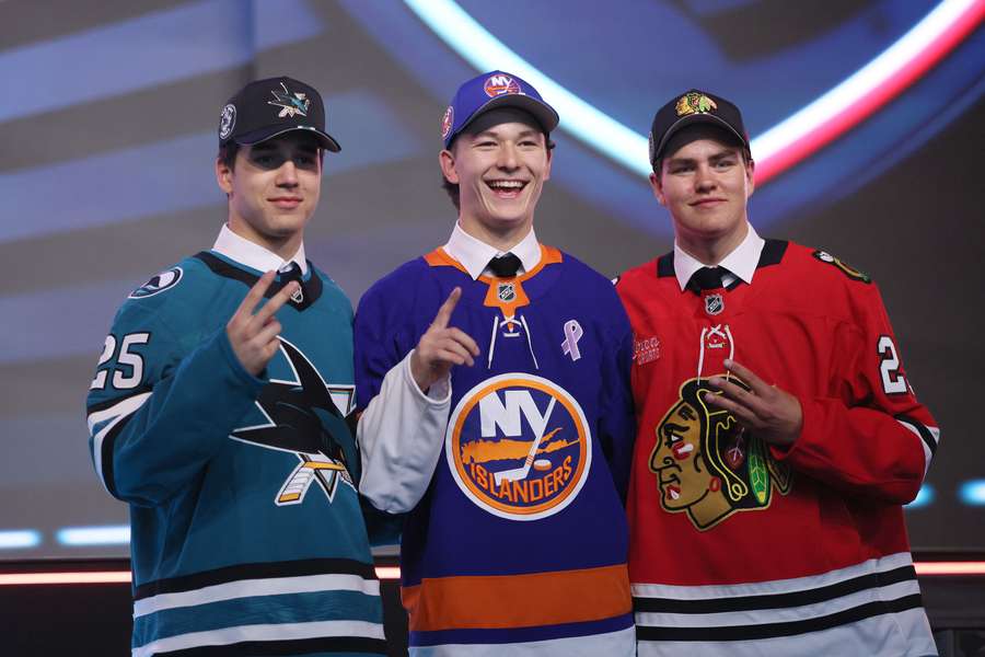 Michael Misa (left), Matthew Schaefer (middle), Anton Frondell (right) pose during Day 1 of the 2025 NHL Draft