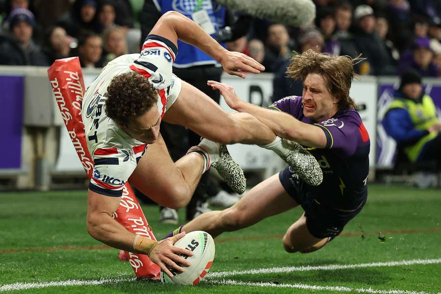 Sydney Roosters winger Mark Nawaqanitawase stretches out to score one of his four tries.