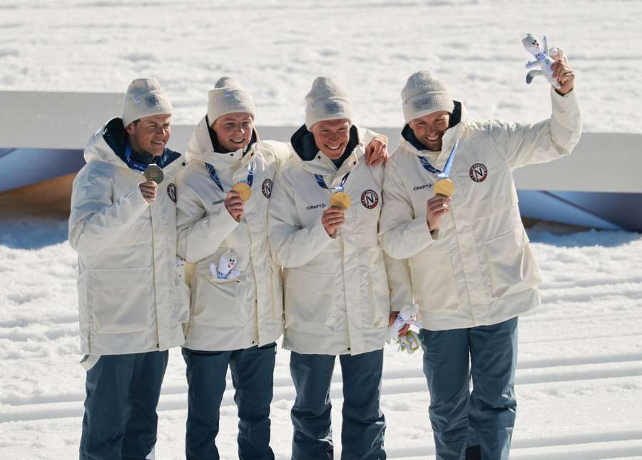 Gold medallists Johannes Hoesflot Klaebo, Einar Hedegart, Martin Loewstroem Nyenget and Emil Iversen of Norway