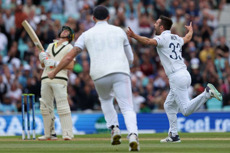 Mark Wood celebrates after taking the wicket of Marnus Labuschagne